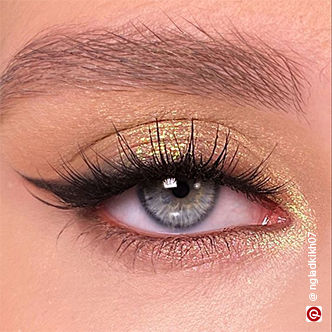 Gold eye makeup with black eyeshadow liner
                                                                                                                                                 