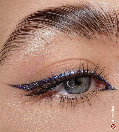 Woman wearing glitter eyeliner