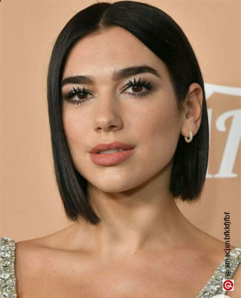 Woman w Dua Lipa sporting a blunt bob 