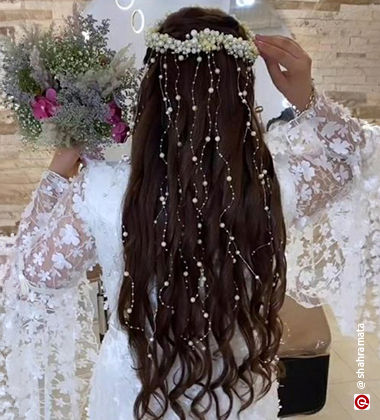 Curls hairstyle embellished with pearls
