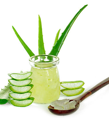 aloe vera gel in a spoon and a jar