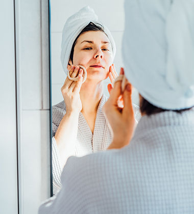 woman in a bathrobe with a towel on head