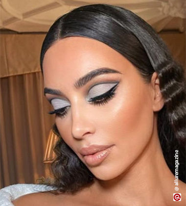 Kim Kardashian with slick back hair and full crease makeup