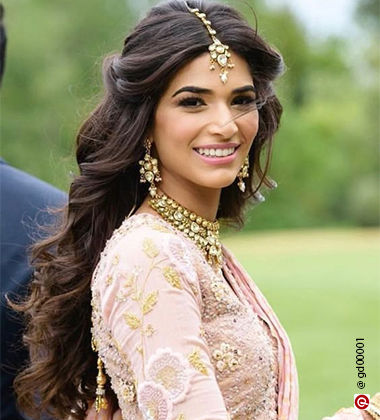 woman looking over her shoulder in a pink outfit