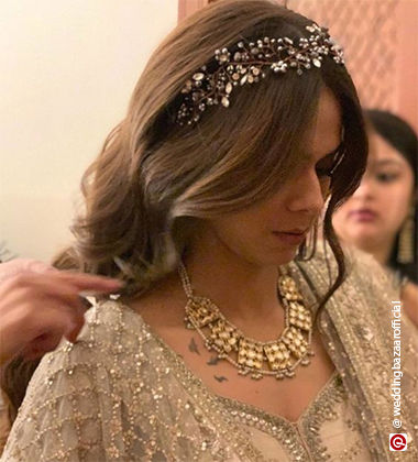 woman wearing a cream suit