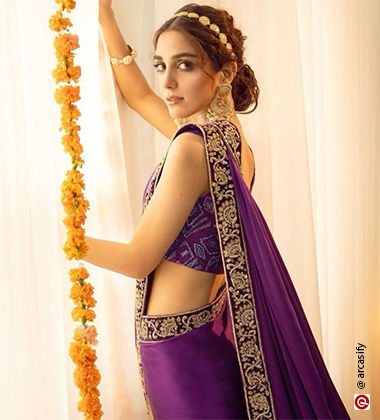 woman in a purple saree