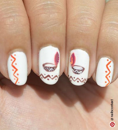  Diwali nail art ideas - diya painted nails 