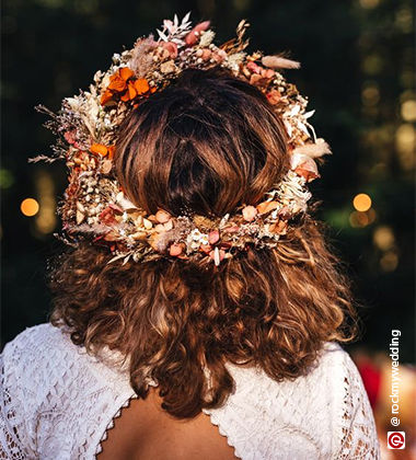 back of a woman with a flower crown around her head