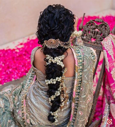 woman surrounded by petals