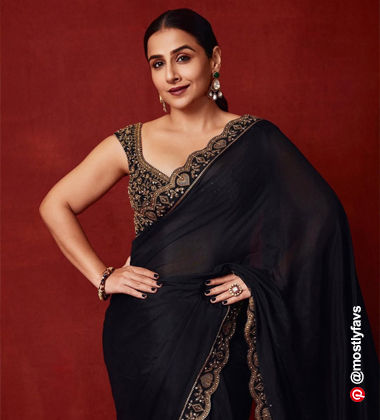 Vidya Balan wearing a black saree and mauve lipstick