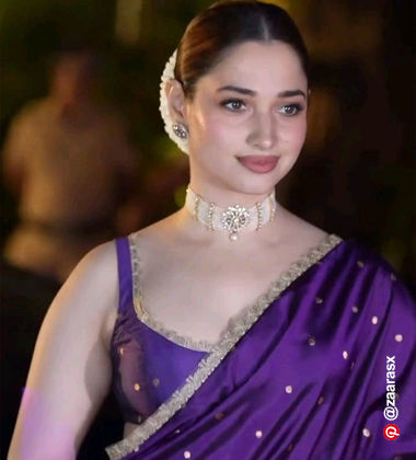 Tamanah wearing a purple saree with a dusty rose lipstick