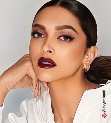 Deepika Padukone wearing a white outfit with berry lips 