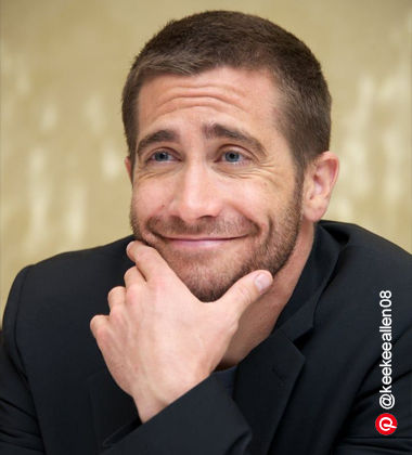 guy smiling with his face resting on his hand