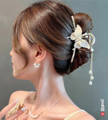 woman with a butterfly clutcher in her hair